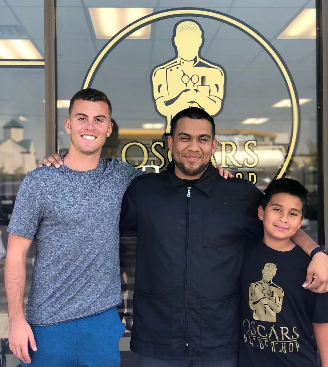 Oscar Ruiz with Brooks Lennon after his haircut at Oscars Barbershop